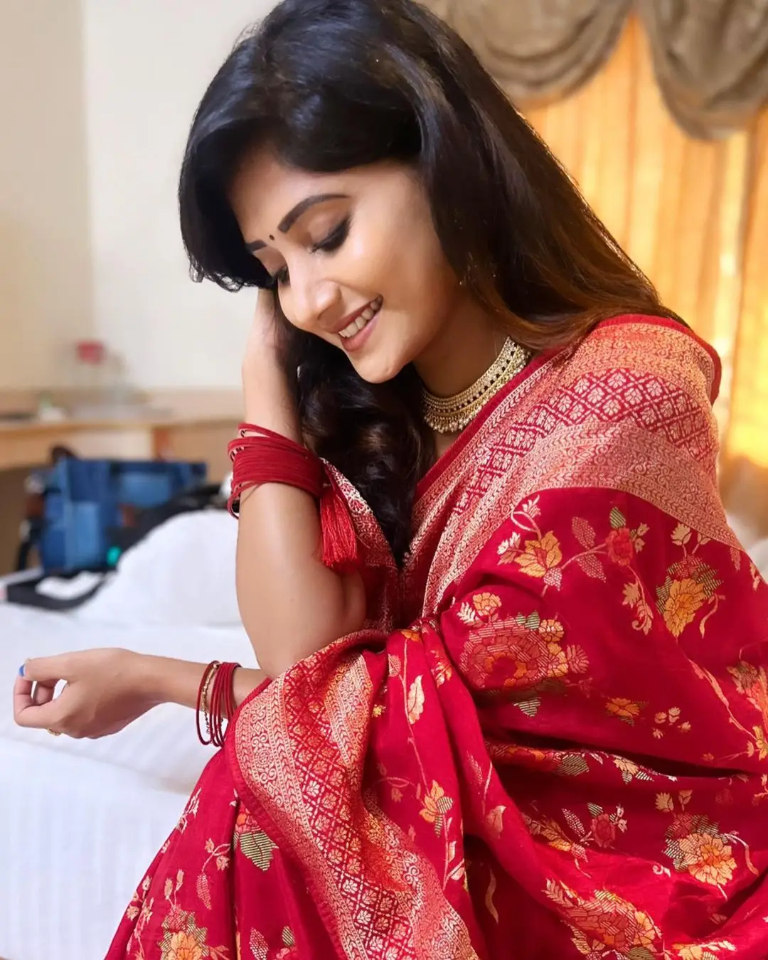 Vasanthi Krishnan Wearing Red Saree Sleeveless Blouse